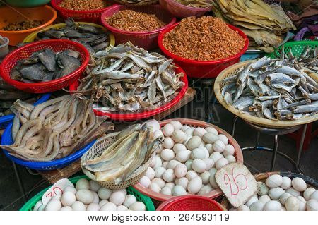 Farmers Market Stall Selling Eggs And Cured Seafood With Dry Fish. Vietnam