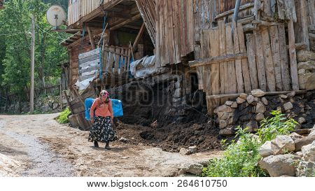 Artvin, Turkey - July 2018: Unidentified Woman In Local Outfit Walking In Maden Village , Savsat, Ar