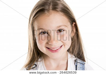 Portrait Of A Cute 7 Years Old Girl Isolated Over White Background
