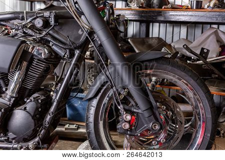Cropped Close Up Shot Of Beautiful And Custom Made Motorcycle In The Workshop