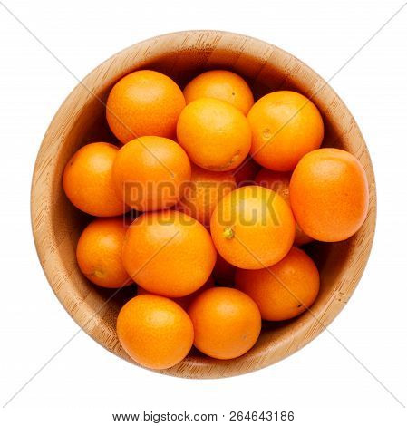 Fresh Whole Kumquats In Wooden Bowl Isolated On White Background. Top View.