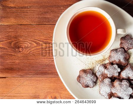 Winter Holiday Composition, Top View, Copy Space, Brown Wooden Background. Tea, Flax Cookies With Ci