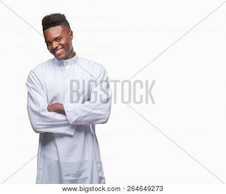 Young arabic african man wearing traditional djellaba over isolated background happy face smiling with crossed arms looking at the camera. Positive person.