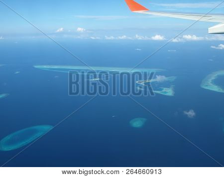 Maledives From Plane In The Water And Island