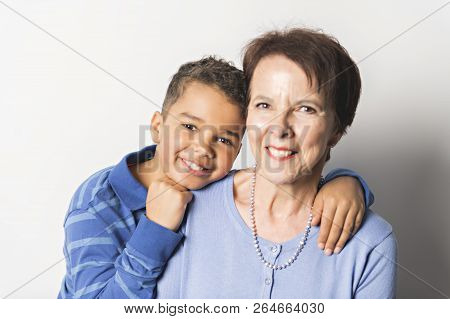 Black Boy With Grandmother In Studio White Background