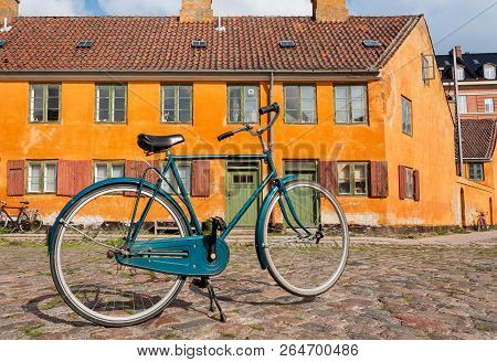 Bicycle Of Locals On Street With Colorful Historical Buildings In Traditional Style Of Copenhagen, D