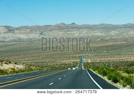 Highway Us 395 Through The Mojave Desert, With Views Of Desert Scenery And Foothills.