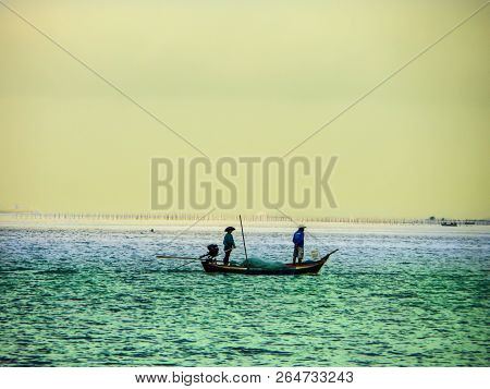 Two Fisherman On Fishing Boat Come Home