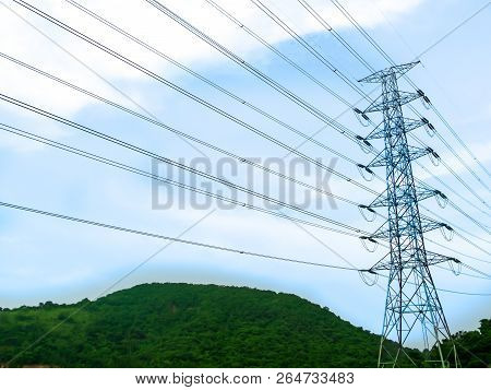 Electric High Power Stand On Green Hill And Blue Sky