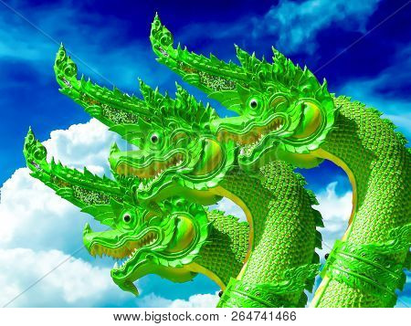 Green Naga Three Heads Blue Sky Background