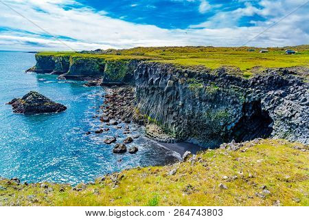 Beautiful Icelandic Landscape With The Cliff Of Basalt Rocks Formation At Arnarstapi Village In Icel