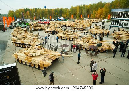 Nizhniy Tagil, Russia - September 25. 2013: Visitors Explore Military Equipment On Exhibition Range.