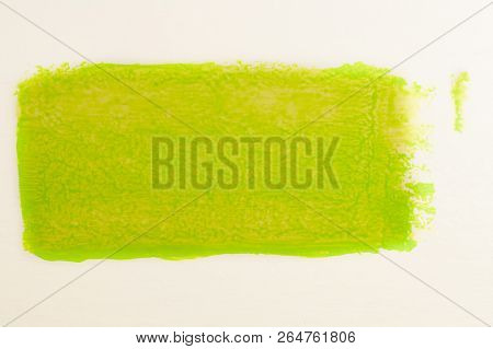 Trail Of Green Paint From Roll For Painting On White Wall. Repair Concept