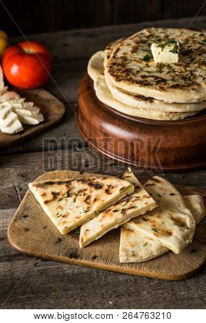 Pita Bread On Wooden Board With Feta Cheese And Tomatoes And Pepper. Still Life Of Food. Georgian Cu