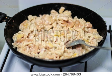 Frying Pan On The Gas Stove. Cooking Meat. Undercooked Meat Dish.