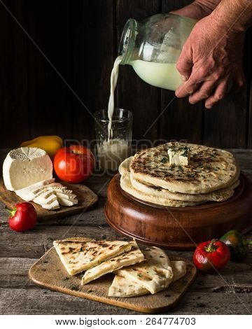 Pita Bread On Wooden Board With Feta Cheese And Tomatoes And Pepper. Still Life Of Food. Georgian Cu