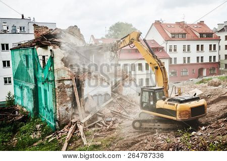 excavator crasher machine at demolition on construction site