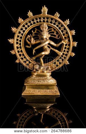 Statue of indian hindu god Shiva Nataraja - Lord of Dance on black background with reflection