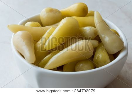 Pickled Green Pepper Pickles In Bowls.
