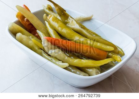 Pickled Green Pepper Pickles In Bowls.