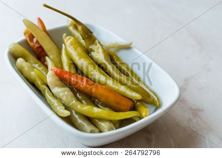 Pickled Green Pepper Pickles In Bowls.