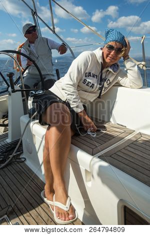POROS, GREECE - OCT 9, 2018: Sailors participate in sailing regatta 20th Ellada Autumn 2018 among Greek island group in the Aegean Sea, in Cyclades and Saronic Gulf.