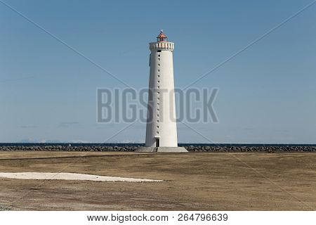 Small lighthouse on the tip of a peninsula