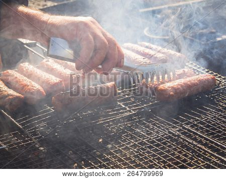 Romanian Mititei And Cooked On The Grill In The Smoke