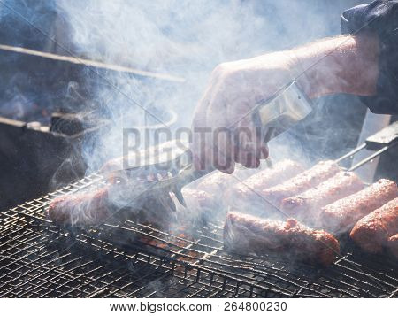 Romanian Mititei And Cooked On The Grill In The Smoke