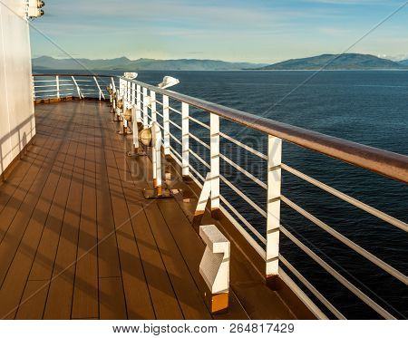 Cruise Ship Port Deck And Railing In Late Afternoon, Inside Passage, Bc, Canada.