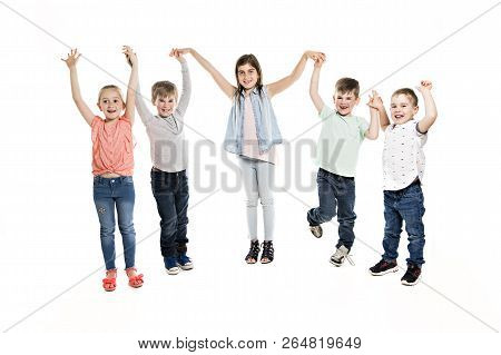 Group Of Five Young Children In Studio