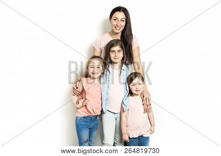 Caucassian Mother With Child Girl In Studio White