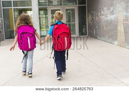 Two Elementary Students Are Going To School