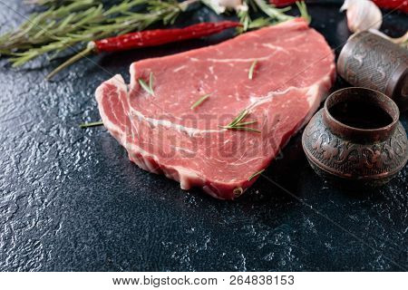 Raw Beef Steak With Spices And Herbs.