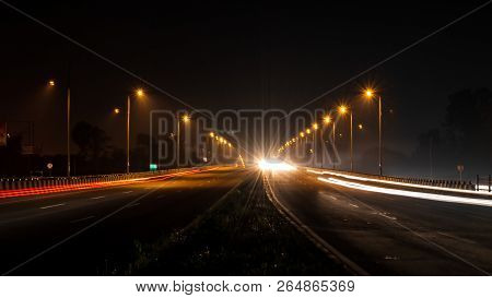 Fast Driving Vehicles Trial At Night, With Long Exposure Blurred Effect At Indian Nation Highway 19 