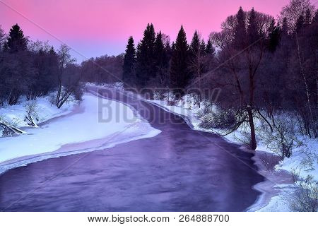 A Rapid In A River In A Wintry Landscape. Photographed At The Rapids In The Dubna River In Russia At