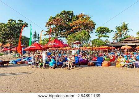 Kuta, Indonesia - September 14, 2018: Tourists And Locals Strolling And Enjoying Sunset At Seminyak 