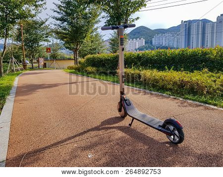 Geoje, South Korea - October 14, 2018 : Ninebot By Segway Es2 Kickscooter Park In The Bicycle Path I