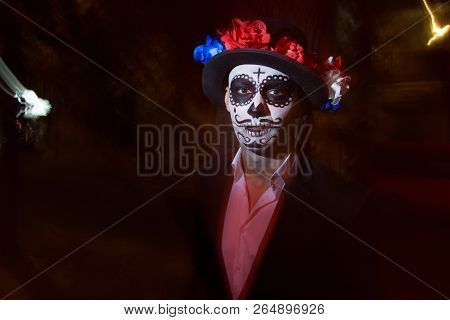 A Man With A Painted Face Of A Skeleton, A Dead Zombie, In The City During The Day. Day Of All Souls