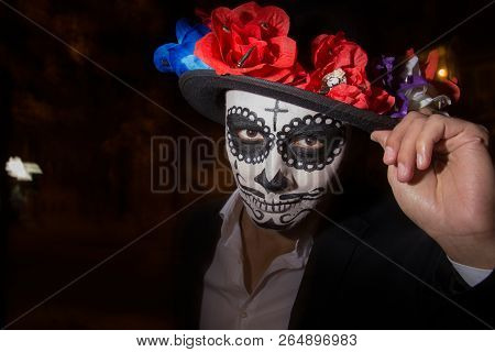 A Man With A Painted Face Of A Skeleton, A Dead Zombie, In The City During The Day. Day Of All Souls