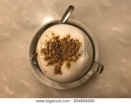 Cappuccino Hot, Creamy And Frothy Coffee With Cinnamon Powder On Top. Top View.