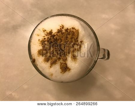 Cappuccino Hot, Creamy And Frothy Coffee With Cinnamon Powder On Top. Top View.