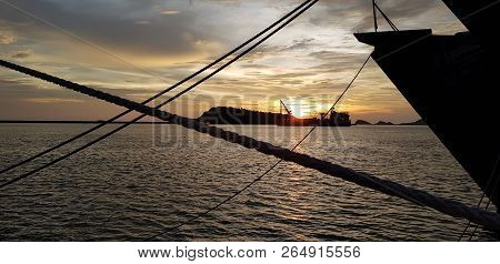 Navy Ship Mooring At Naval Base With Off Shore Vessel Behind