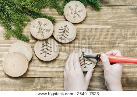Christmas Homemade Pyrography Toys. Wooden Slice. Xmas Decorations. Child Makes Gifts For Relatives.