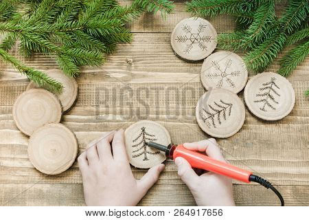 Christmas Homemade Pyrography Toys. Wooden Slice. Xmas Decorations. Child Makes Gifts For Relatives.