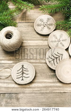 Christmas Homemade Pyrography Toys. Wooden Slice. Alternative Decor. Christmas Decorations. Close Up