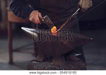 Metalworker Forming A Coil With Hot Metal