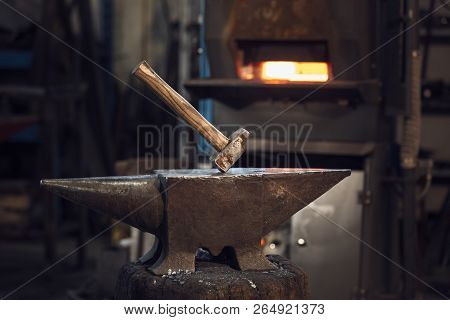 Mallet On An Anvil In Front Of A Furnace