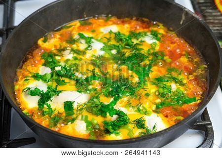 Cook Shakshuka On A Gas Stove In A Frying Pan.