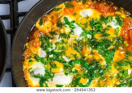 Cook Shakshuka On A Gas Stove In A Frying Pan.